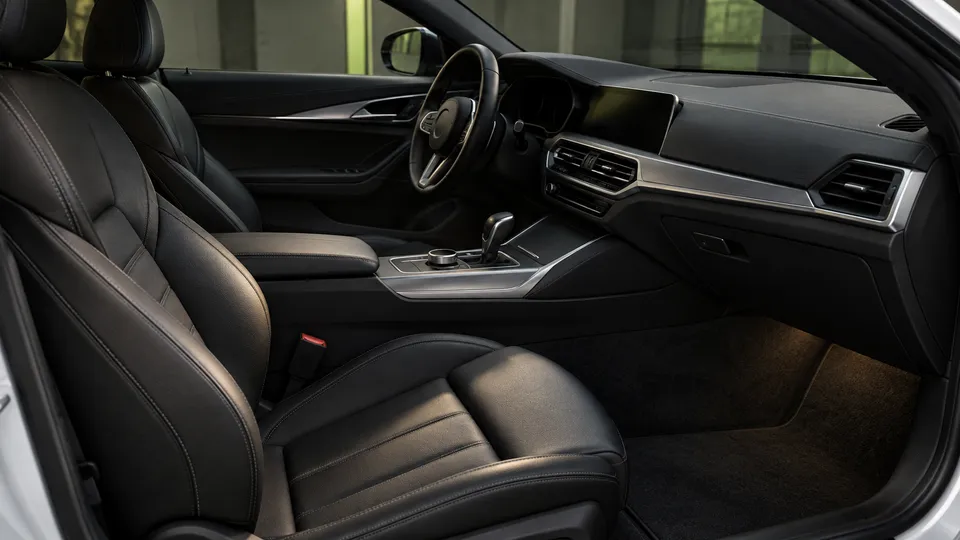 Generated concept of a tidy warm black car interior with silver trim and blank displays.